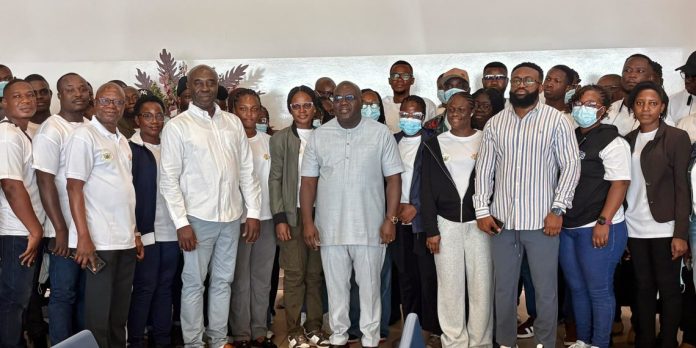 Chief of Staff Dr. Julius Debrah and Minister of Labour, Jobs and Employment, Emmanuel Kwadwo Agyekum with some of the health workers deployed
